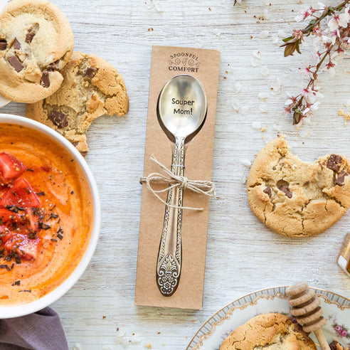 printed soup-er mom spoon. surrounded by decorative props