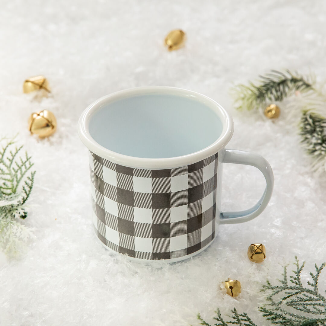 White and Grey plaid mug, surrounded by decorative props