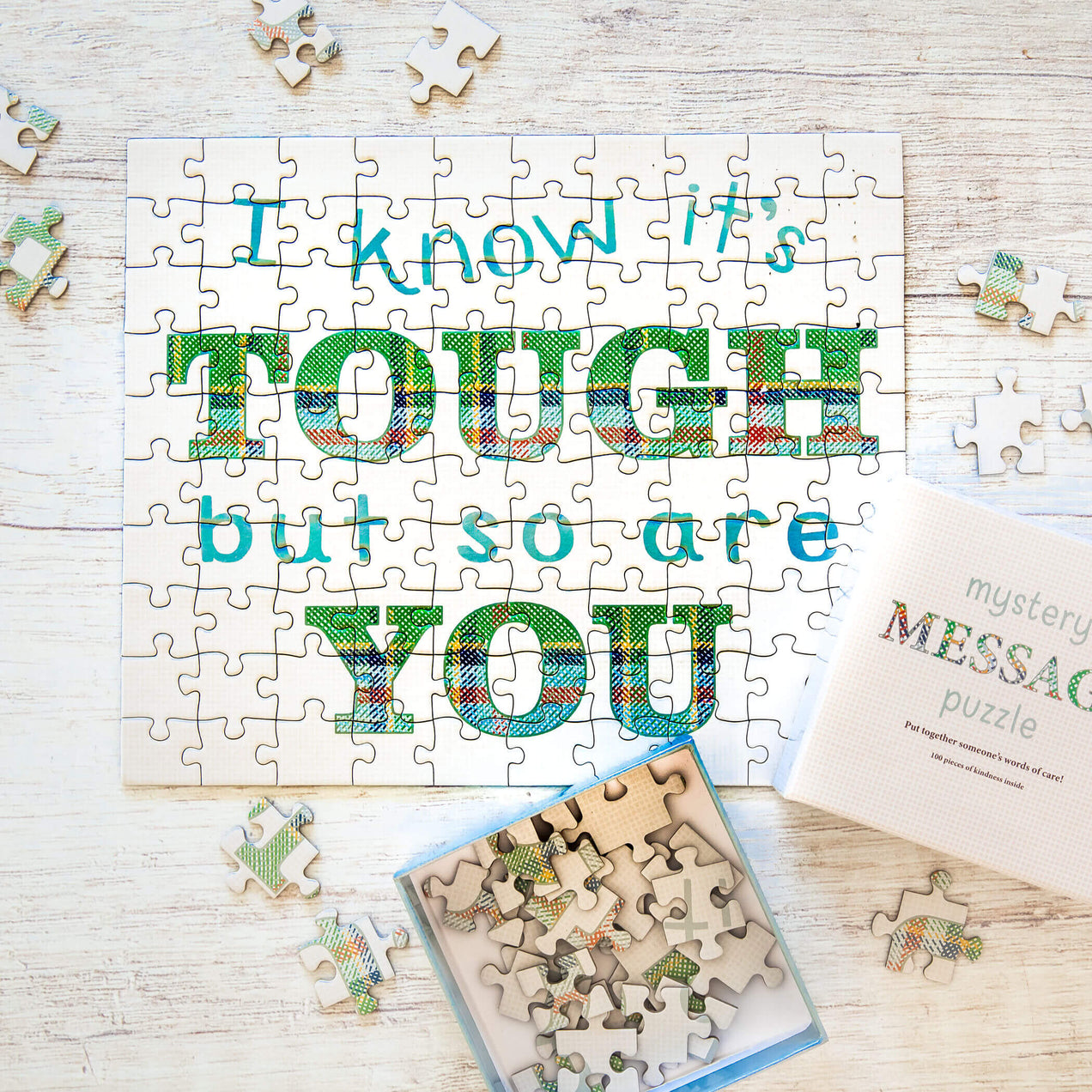 I know it is tough but so are you puzzle, surrounded by puzzle pieces and box